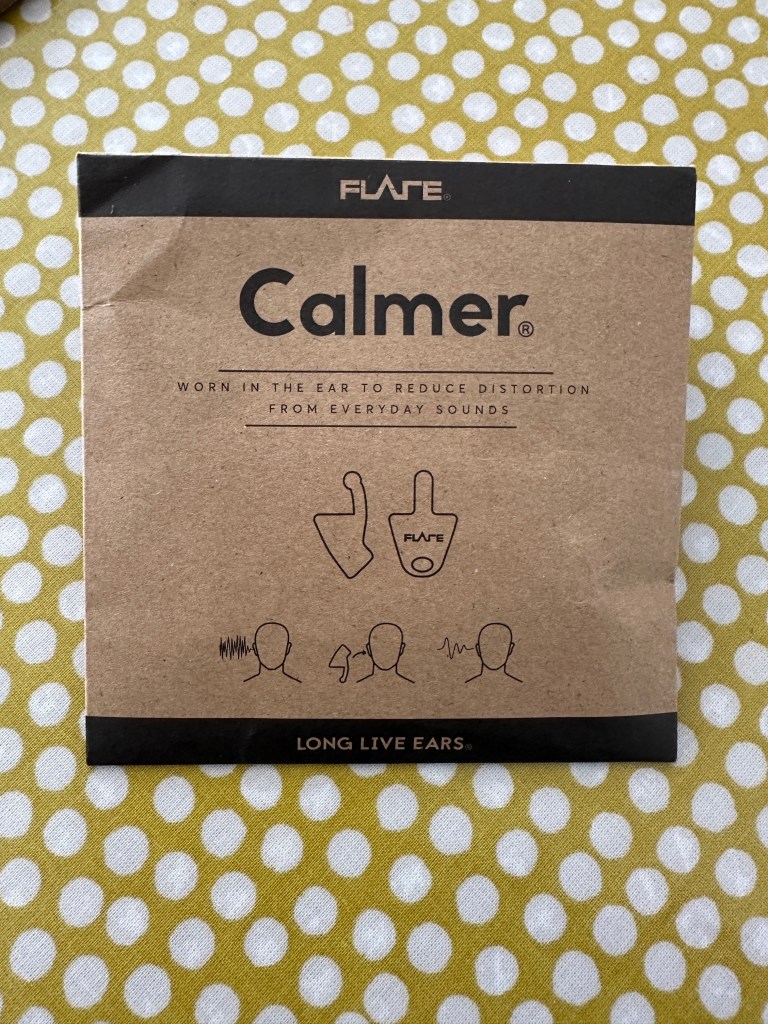 A square cardboard pouch with Calmer written across the front. 