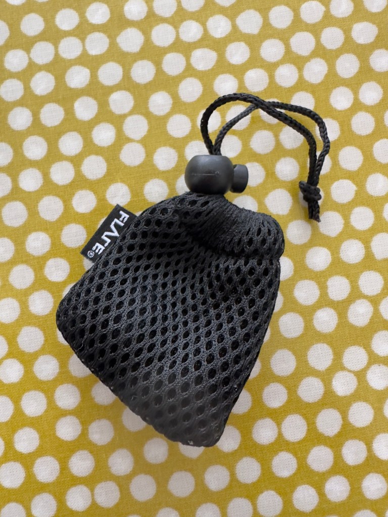 A small black drawstring pouch with a 'flare' label on the side. 